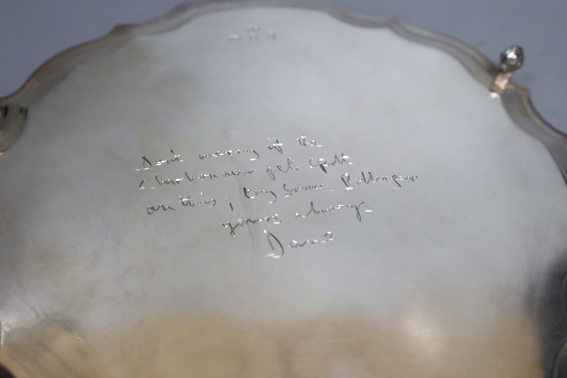 A modern silver salver with scroll feet and inscription verso, maker, HB, London, 1972, 25.3cm, 14.9oz.